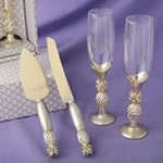 pineapple themed gold flutes and gold cake server accessory set