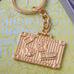 Gold luggage tag key chain