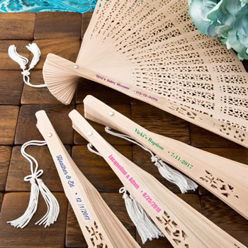 Intricately carved personalized Sandalwood fan favors from Fashioncraft&reg;