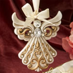 Antique ivory Angel Ornament with a matte gold filigree detailing